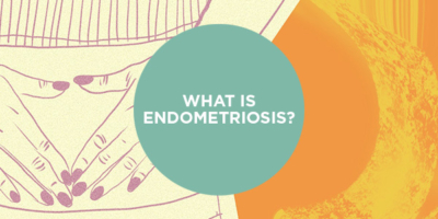 Two hands are placed over the lower abdomen of a stylised female figure against a background split in orange and purple hues, with text "WHAT IS ENDOMETRIOSIS?"